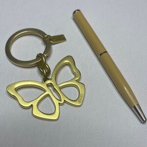 Coach Gold Butterfly Keychain and Cream Coach Pen